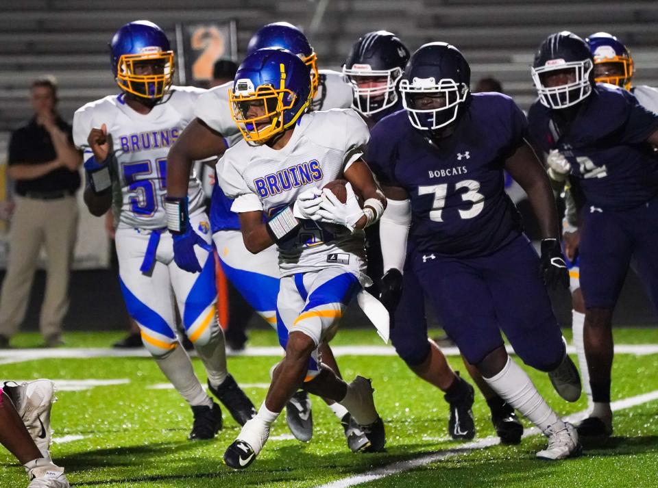 Bayshore running back Ramos Castellanos-Diaz runs up field during Friday night's game against North Port.