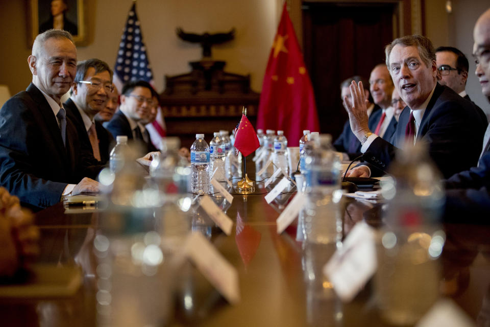 US Trade Representative Robert Lighthizer, right, accompanied by Trump Administration officials, meets with Chinese Vice Premier Liu He, left, and other Chinese officials as they begin US-China Trade Talks in the Diplomatic Room of the Eisenhower Executive Office Building on the White House Complex, Wednesday, Jan. 30, 2019, in Washington. (AP Photo/Andrew Harnik)