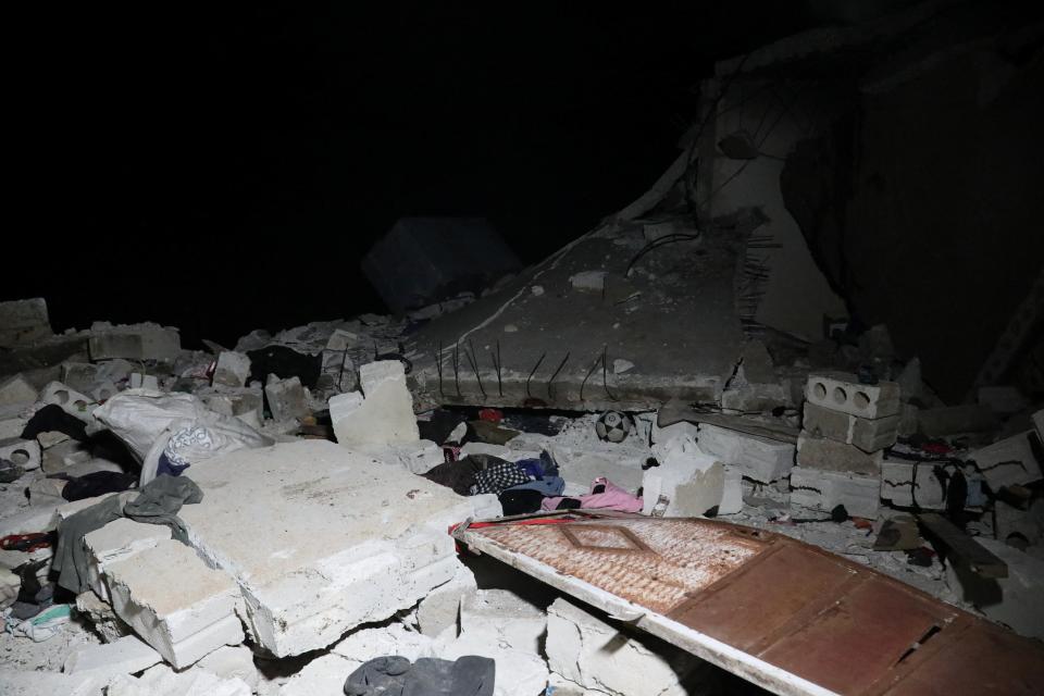 Debris and rubble are seen in the aftermath of a counter-terrorism mission conducted by the U.S. Special Operations Forces in Atmeh, Syria, February 3, 2022 (Mohamed Al-Daher via REUTERS)