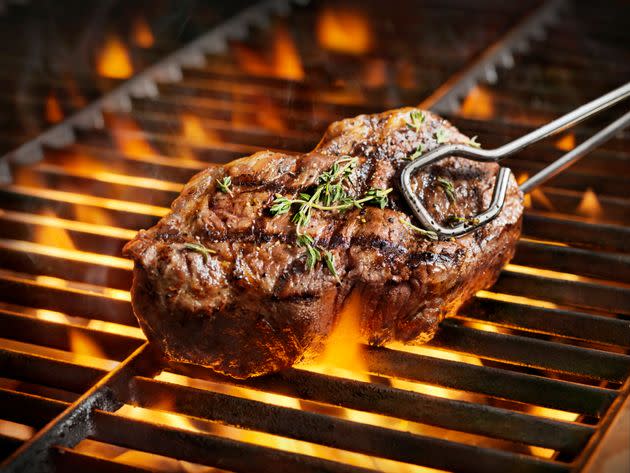 Pat LaFrieda advises leaving your grill's cover open while you're grilling your steak. (Photo: LauriPatterson via Getty Images)