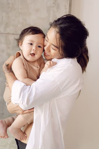 <p>Michelle Mishina</p> Angela Lee with her daughter Ava Marie in 2022