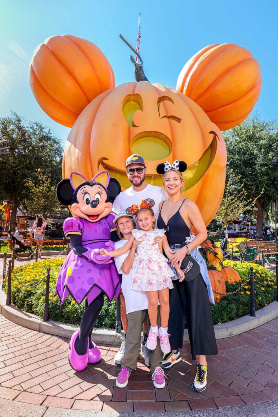 PHOTO: In this handout image provided by Disneyland Resort, actress Kate Hudson and her family celebrate her daughter Rani Rose's birthday with Minnie Mouse during Halloween Time at Disneyland Park on Sept. 26, 2022 in Anaheim, Calif. (Handout/Disneyland Resort via Getty Images)
