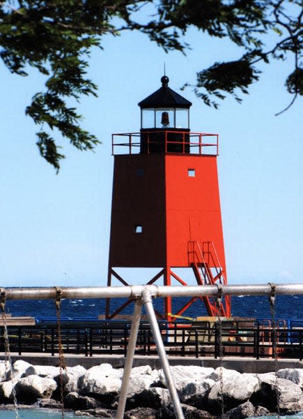 Lighthouse repainted red, 2009, before it began to fade within two years.