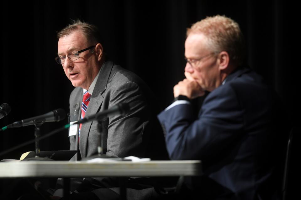 Finalist Randall Hemann speaks during a public forum with the two final candidates for Oak Ridge city manager, in Oak Ridge High School’s auditorium, Wednesday, Aug. 16, 2023. At left is Lane Bailey of GovHR USA, the executive search firm hired by city council.