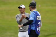 Collin Morikawa greets his caddie Jonathan Jakovac on the 18th hole after their final round of the PGA Championship golf tournament at TPC Harding Park Sunday, Aug. 9, 2020, in San Francisco. (AP Photo/Charlie Riedel)