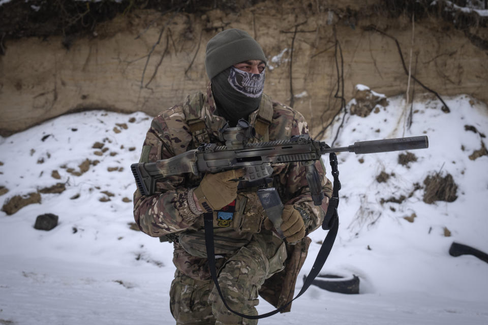 A member of the pro-Ukrainian Russian ethnic Siberian Battalion practices at a military training close to Kyiv, Ukraine, Wednesday, Dec. 13, 2023. Ukraine's military has formed a battalion of soldiers made up entirely of Russian citizens who want to fight against Russian invasion.(AP Photo/Efrem Lukatsky)