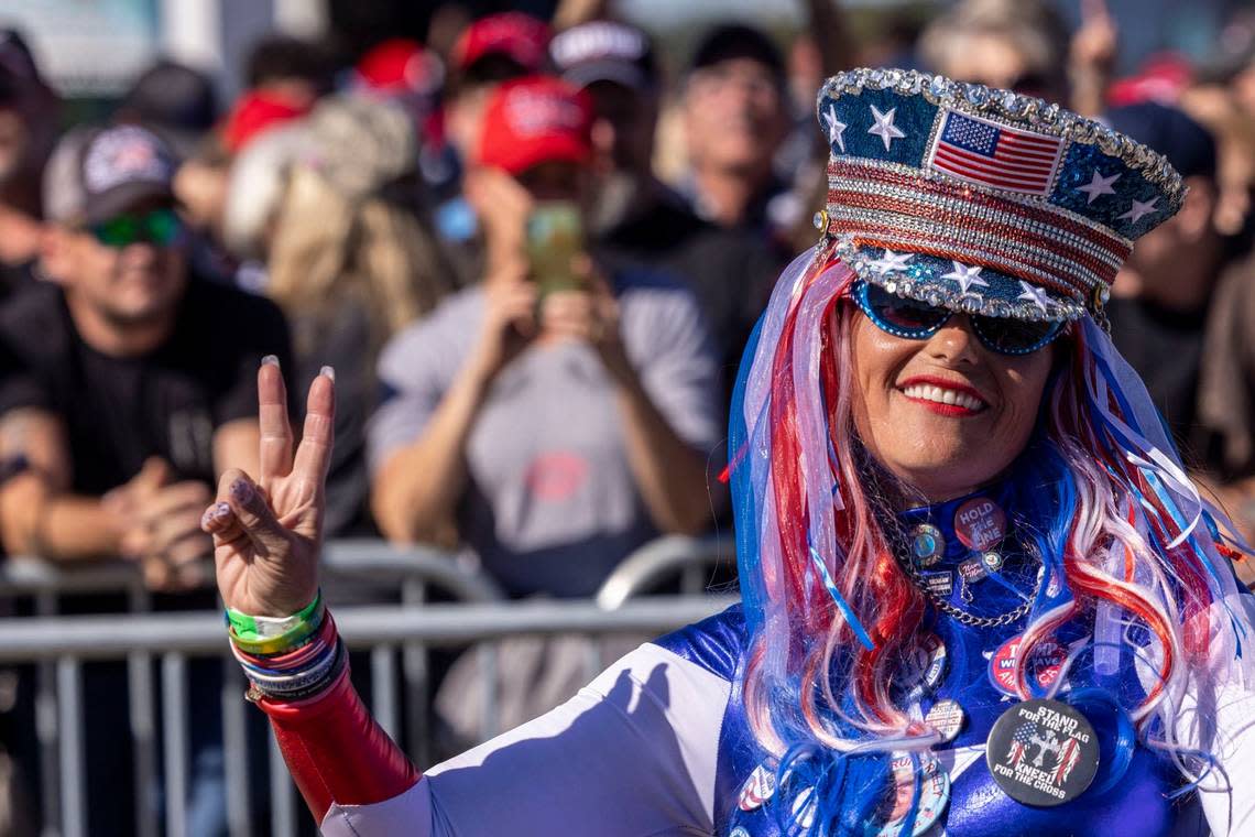 Micki Larson-Olson dances prior to a rally featuring former president Donald Trump, at Wilmington International Airport Friday, Sept. 23, 2022.