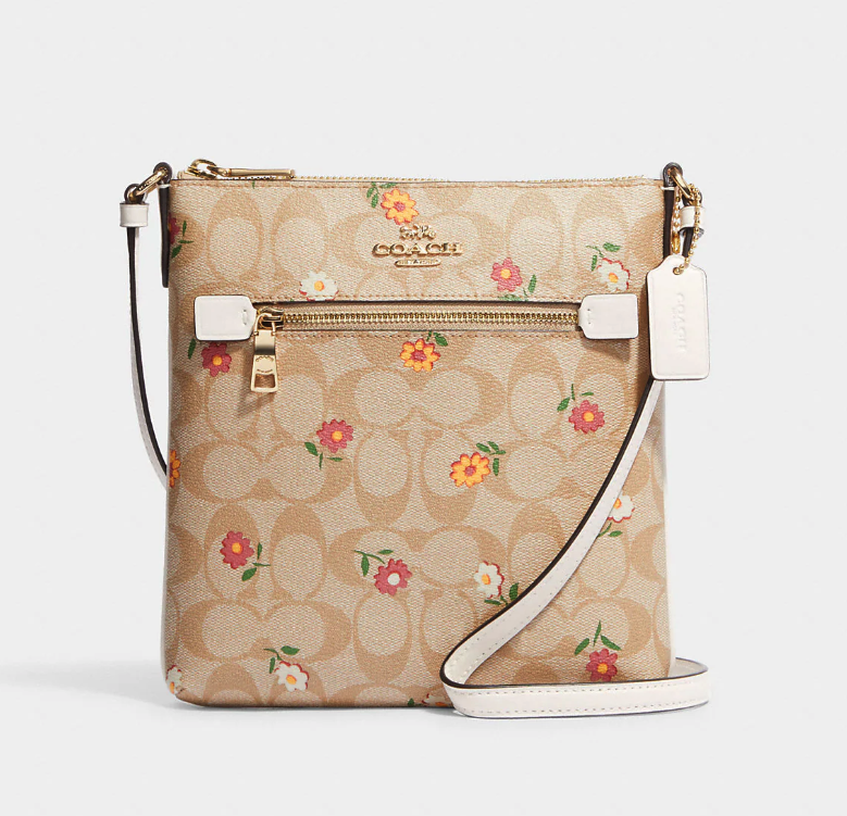 Mini Rowan File Bag In Signature Canvas With Nostalgic Ditsy Print. Image via Coach Outlet.