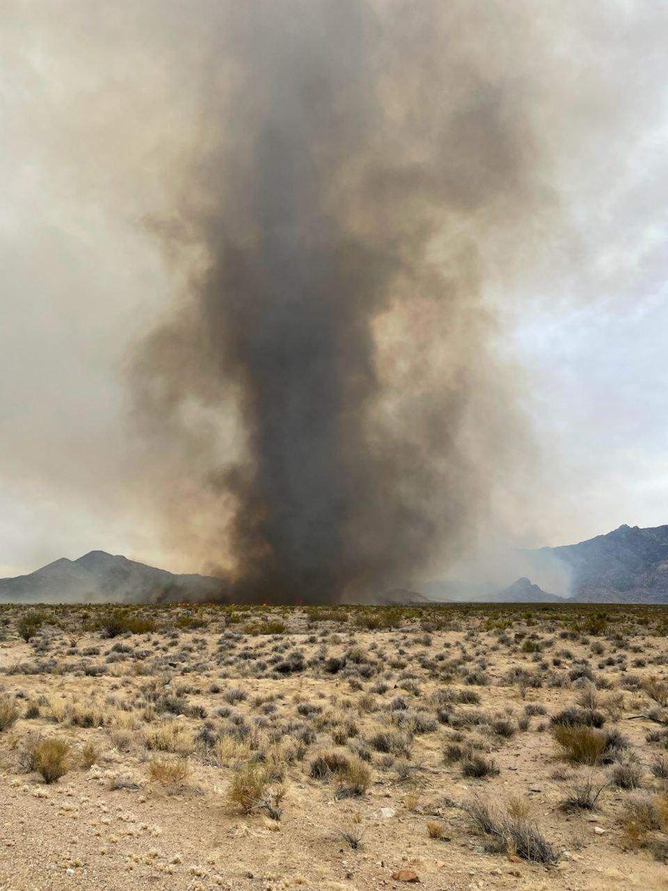 In this photo provided by the National Park Service, is a large fire whirl at the York Fire in the Mojave National Preserve, Calif., Sunday, July 30, 2023. A massive wildfire burning out of control in California's Mojave National Preserve was spreading rapidly amid erratic winds, while firefighters reported progress against another major blaze to the southwest that prompted evacuations. (National Park Service via AP)
