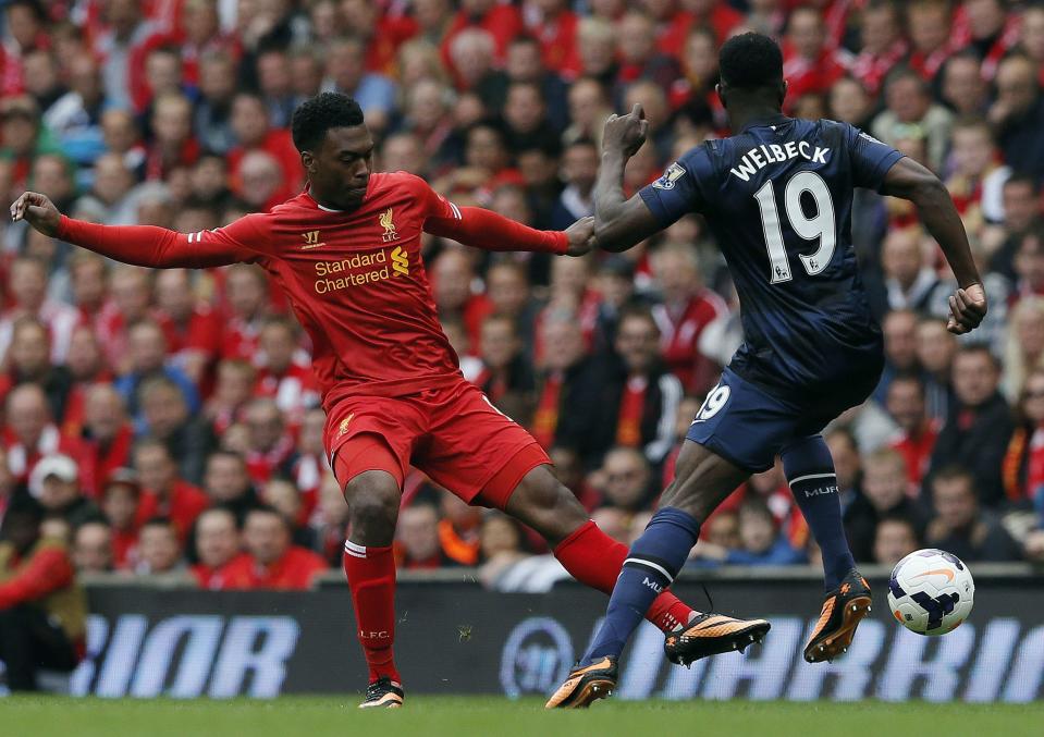 Liverpool's Sturridge fights for the ball with Manchester United's Danny Welbeck during their English Premier League soccer match at Anfield