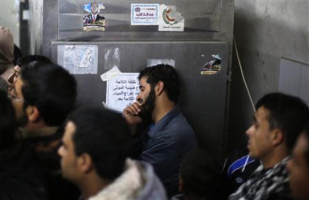 A Palestinian relative of Ibrahim Mansour, 26, who was killed by Israeli soldiers, reacts inside a hospital morgue in Gaza City February 13, 2014. REUTERS/Suhaib Salem