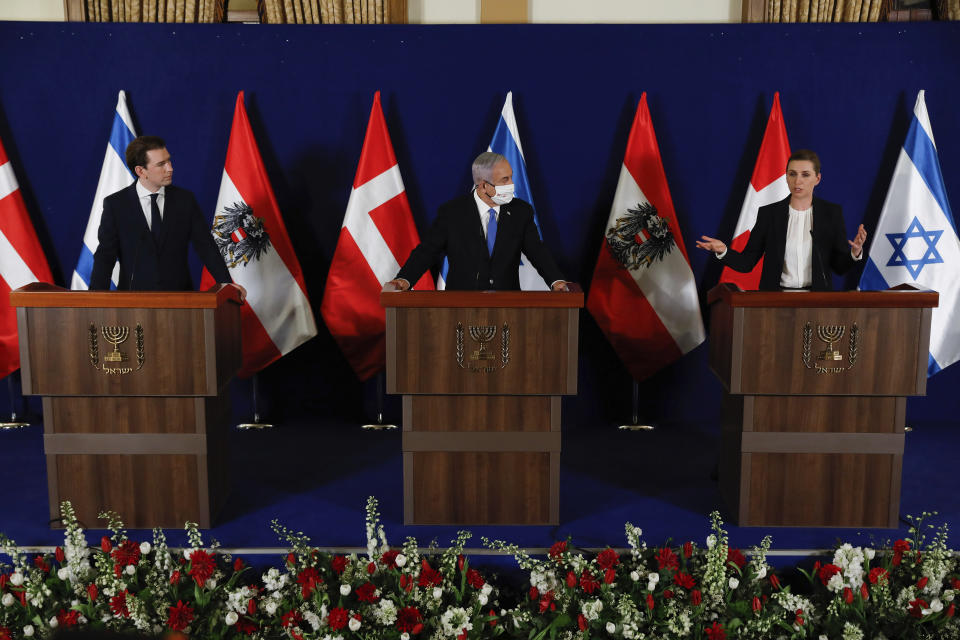 Israeli Prime Minister Benjamin Netanyahu, center, Danish Prime Minister Mette Frederiksen, left, and Austrian Chancellor Sebastian Kurz, right, speak during a joint statement at the Israeli Prime minister office in Jerusalem on Thursday, March 4, 2021. (Olivier Fitoussi/Pool Photo via AP)