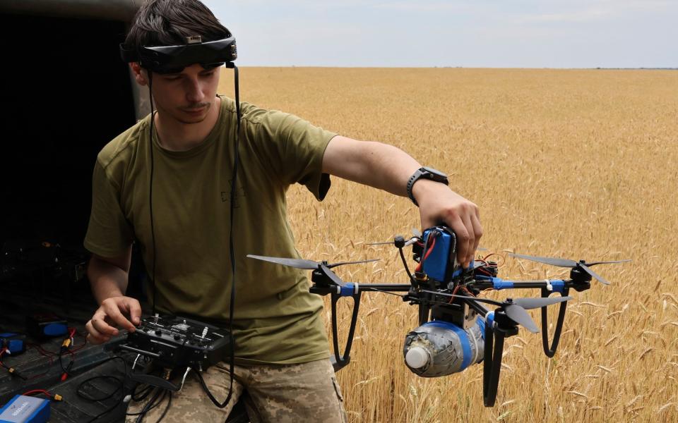 A Ukrainian serviceman of the Sky Hunters unit of the 65-th brigade operates a drone on the front line in Zaporizhzhia