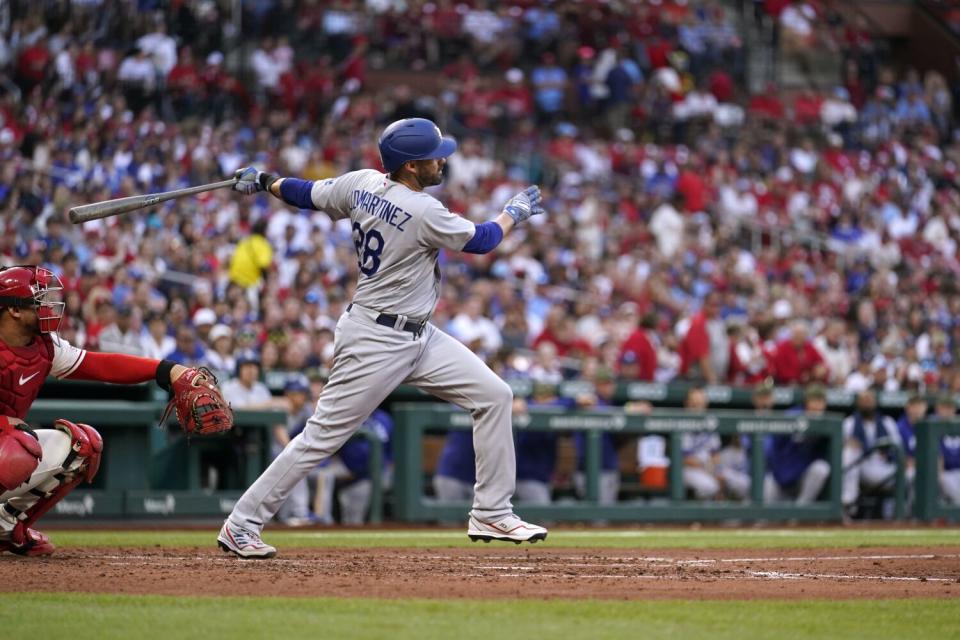 The Dodgers&#39; J.D. Martinez connects on a three-run home run during the sixth inning to tie the score.