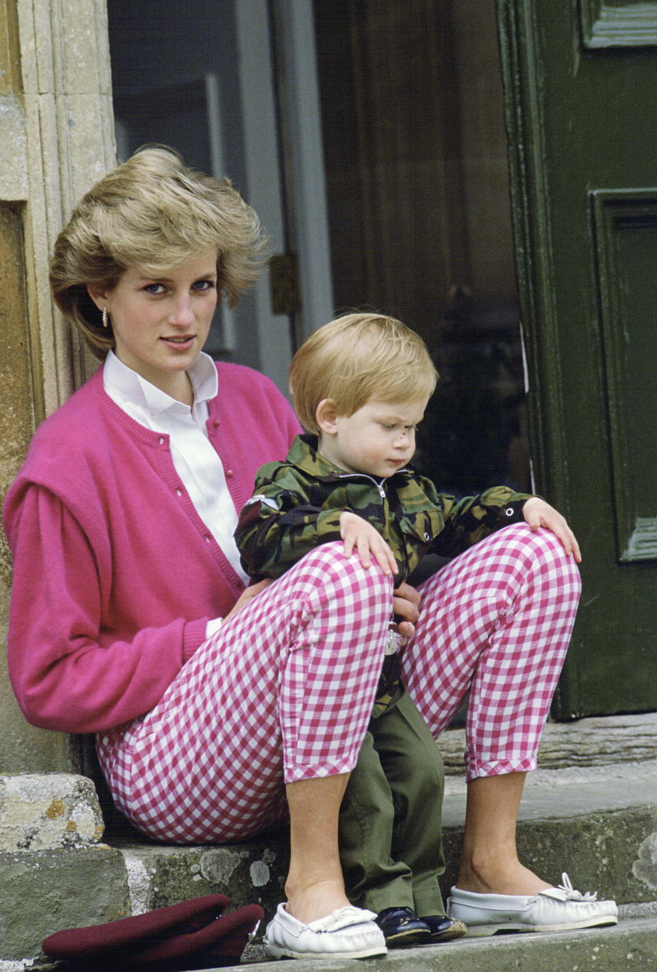 TETBURY, UNITED KINGDOM - JULY 18:  Princess Diana Sitting Outside Highgrove With Her Son Harry Who Is In Uniform As A Soldier  (Photo by Tim Graham Photo Library via Getty Images)