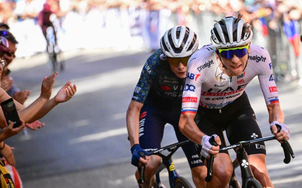 Tadej Pogacar and Jonas Vingegaard cycle up the San Luca ascent