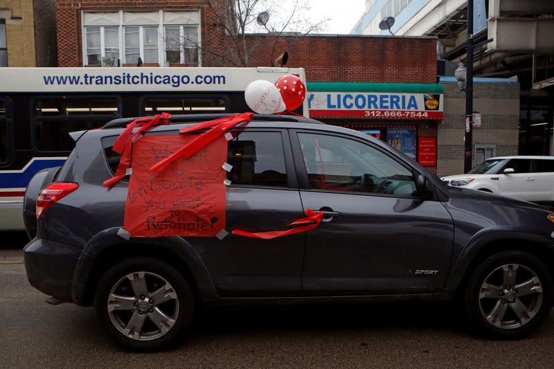 Supporters of the Chicago Teachers Union participate in a car caravan