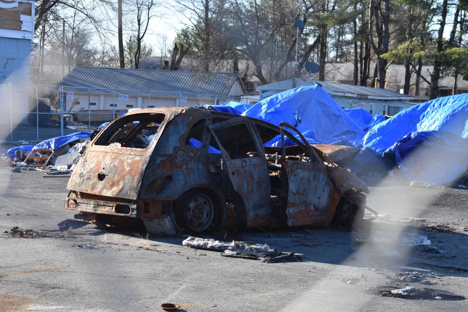 The rubble that was the 613 Automotive Group in Ellenville, including this burned-out car, remains on the site eight months after a fire destroyed the business while an HBO miniseries was being filmed there.