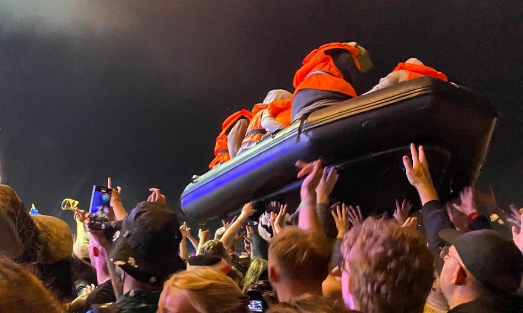 <span>The Banksy-created boat at Idles’ Other stage set.</span><span>Photograph: Safi Bugel/The Guardian</span>