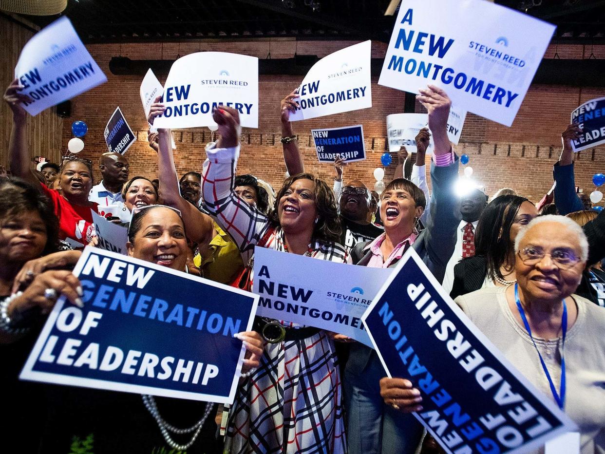 Supporters cheer as results come in at Steven Reed's mayoral campaign party: AP