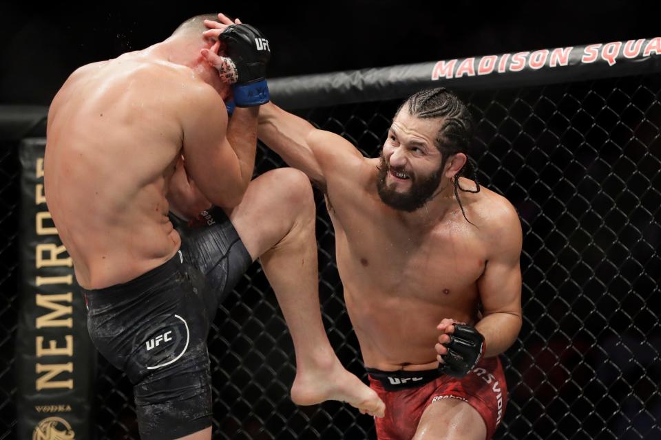 Jorge Masvidal, right, punches Nate Diaz during the second round of a welterweight mixed martial arts bout at UFC 244 on Nov. 3, 2019 in New York. Masvidal won by TKO in the third round.