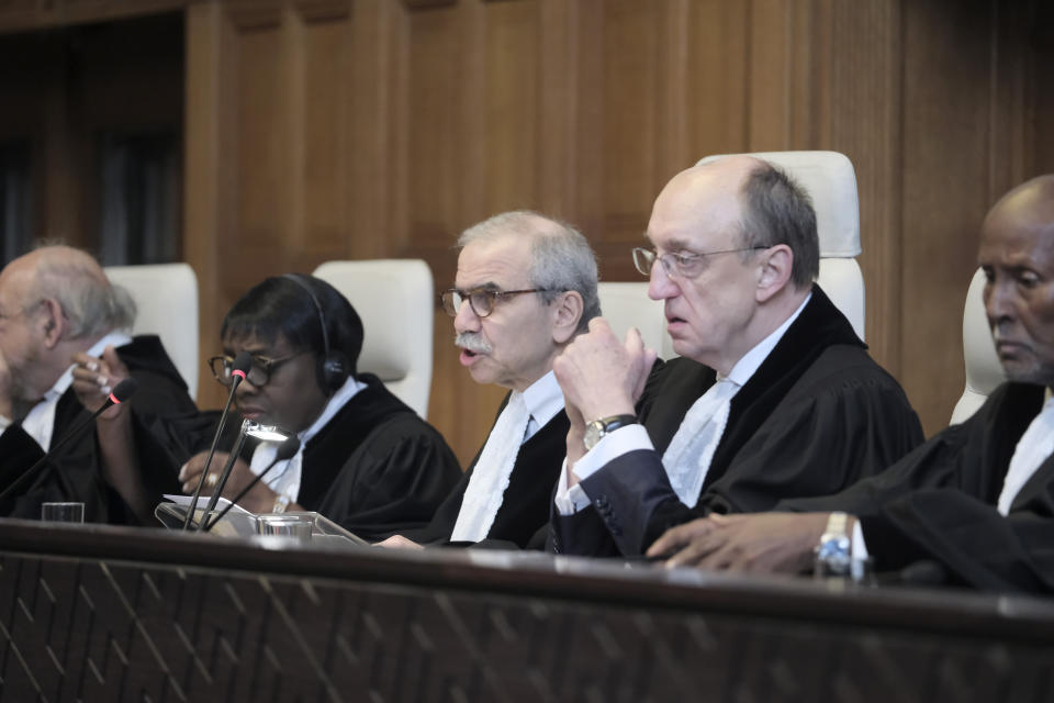 Judge Nawaf Salam, center, speaks at the start of a two days hearing at the World Court in The Hague, Netherlands, Monday, April 8, 2024, in a case brought by Nicaragua accusing Germany of breaching the genocide convention by providing arms and support to Israel. (AP Photo/Patrick Post)