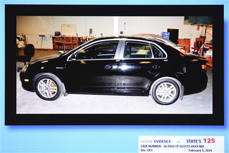 An evidence photo of the VW Jetta driven by Michael Davis on the night of the shooting is pictured during the murder trial of Michael Dunn for the shooting death of Jordan Davis at Duval County Courthouse in Jacksonville, Florida February 6, 2014. REUTERS/Bob Mack/Florida Times-Union/Pool