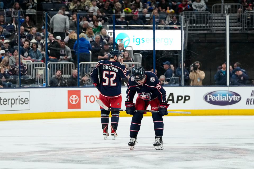 Columbus Blue Jackets right wing Emil Bemstrom (52) and center Jack Roslovic (96) react to a goal by Buffalo Sabres center Casey Mittelstadt (37) during the third period of the NHL hockey game at Nationwide Arena in Columbus on April 14, 2023. The Blue Jackets lost 5-2.