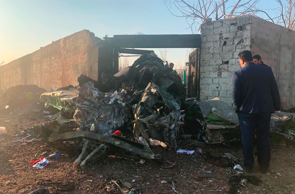  Debris is seen from the plane crash on the outskirts of Tehran, Iran (AP)