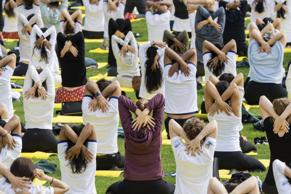 People practice yoga during the International Yoga day event at United Nations headquarters in New York on Wednesday, June 21, 2023. India Prime Minister Narendra Modi has joined diplomats and dignitaries at the United Nations for a morning session of yoga, praising it as “truly universal” and “a way of life.” (AP Photo/Jeenah Moon)