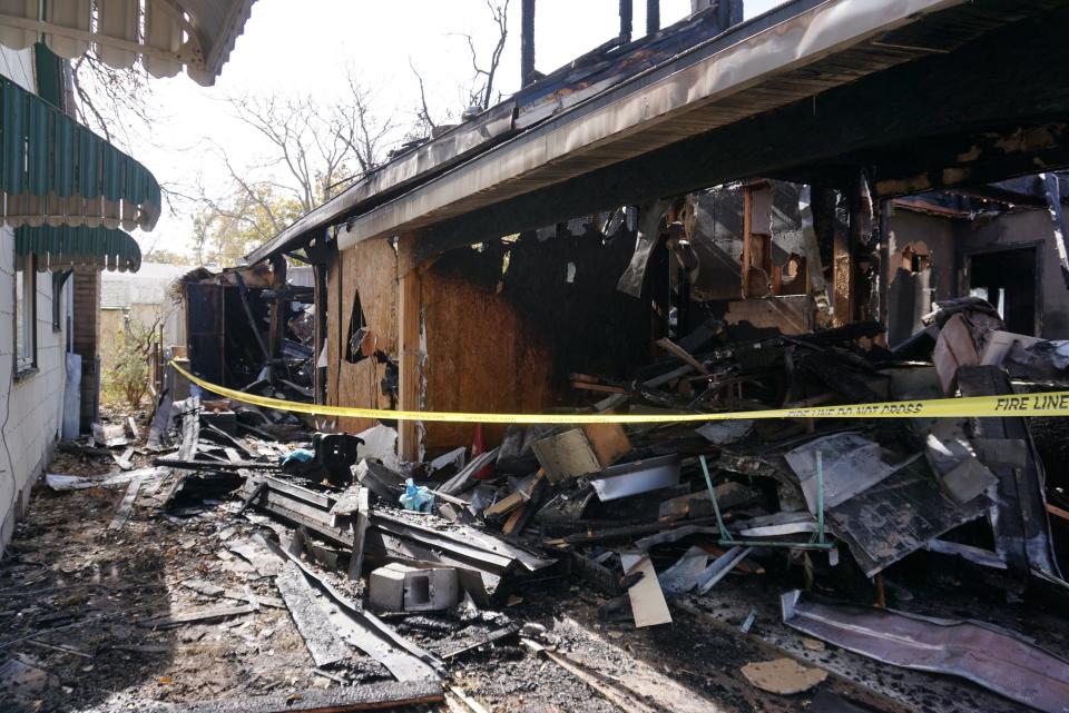 The extensive damage caused by a house fire on Thanksgiving could be seen from the side of the road.