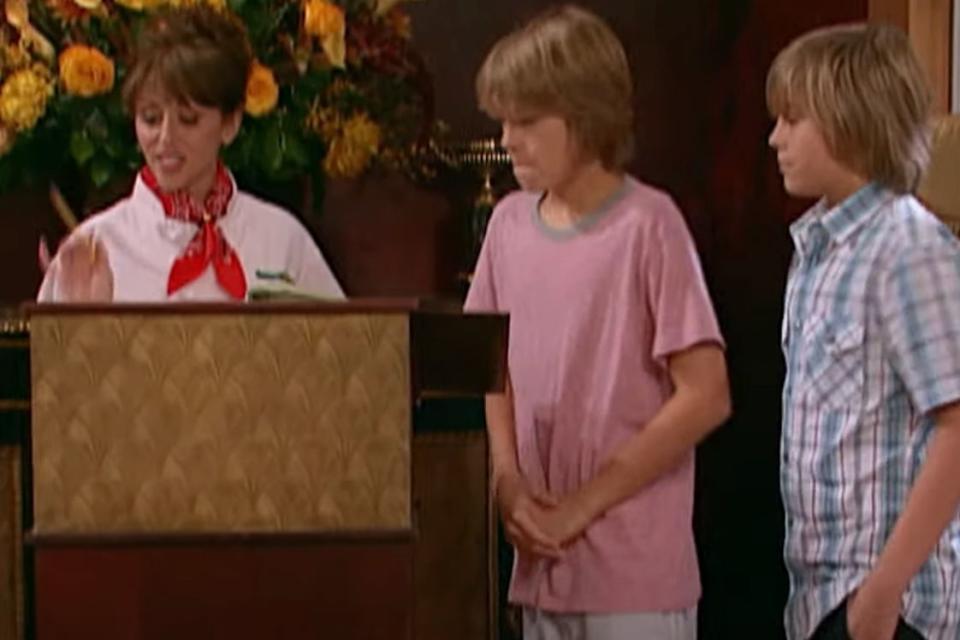 <p>Disney Channel/YouTube</p> Dylan and Cole Sprouse during the dinner reservation scene on 