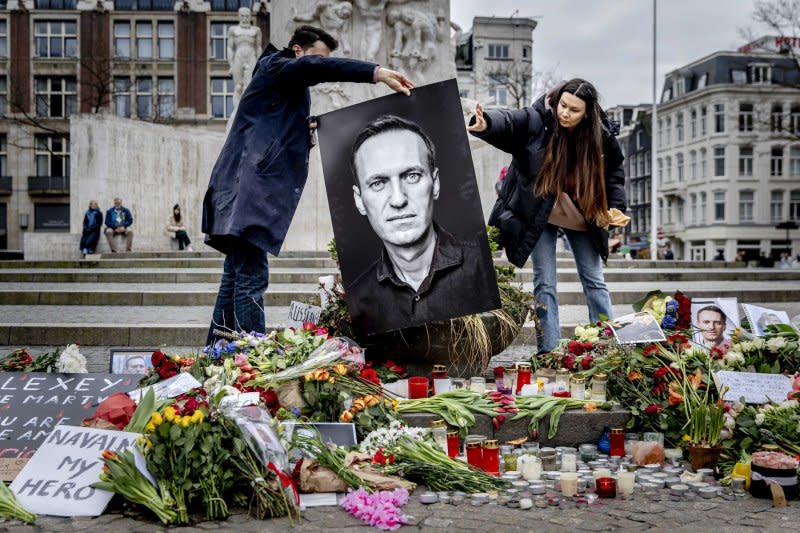 People gather at Dam Square in Amsterdam, Netherlands, on Saturday to hold a vigil for Russian opposition leader Alexei Navalny. Navalny's team confirmed he had died in detention in Russia at the age of 47. Photo by Remko de Waal/EPA-EFE