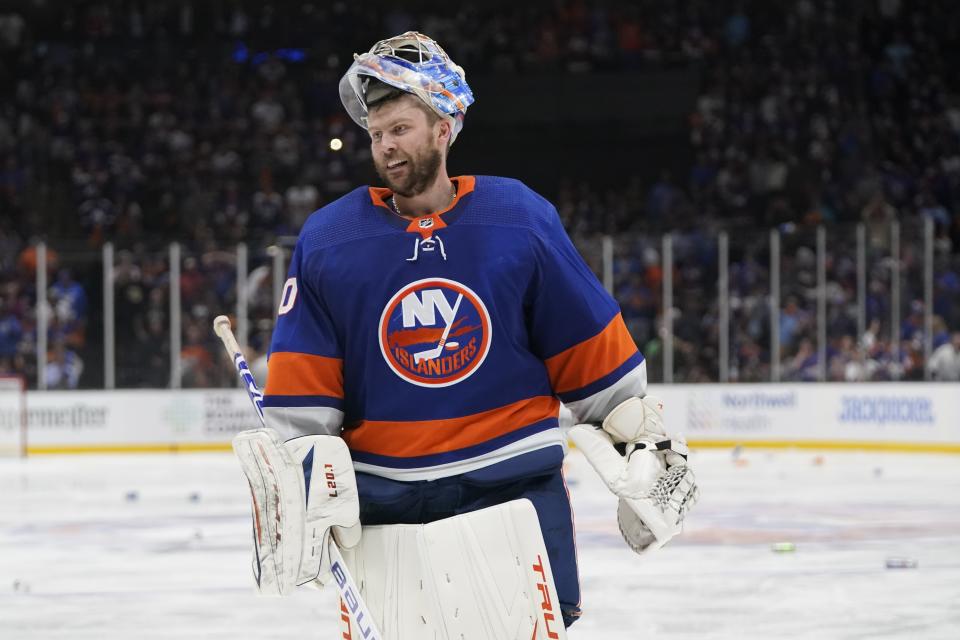 New York Islanders goaltender Semyon Varlamov smiles after Game 6 of an NHL hockey semifinals against the Tampa Bay Lightning Wednesday, June 23, 2021, in Uniondale, N.Y. The Islanders won 3-2. (AP Photo/Frank Franklin II)