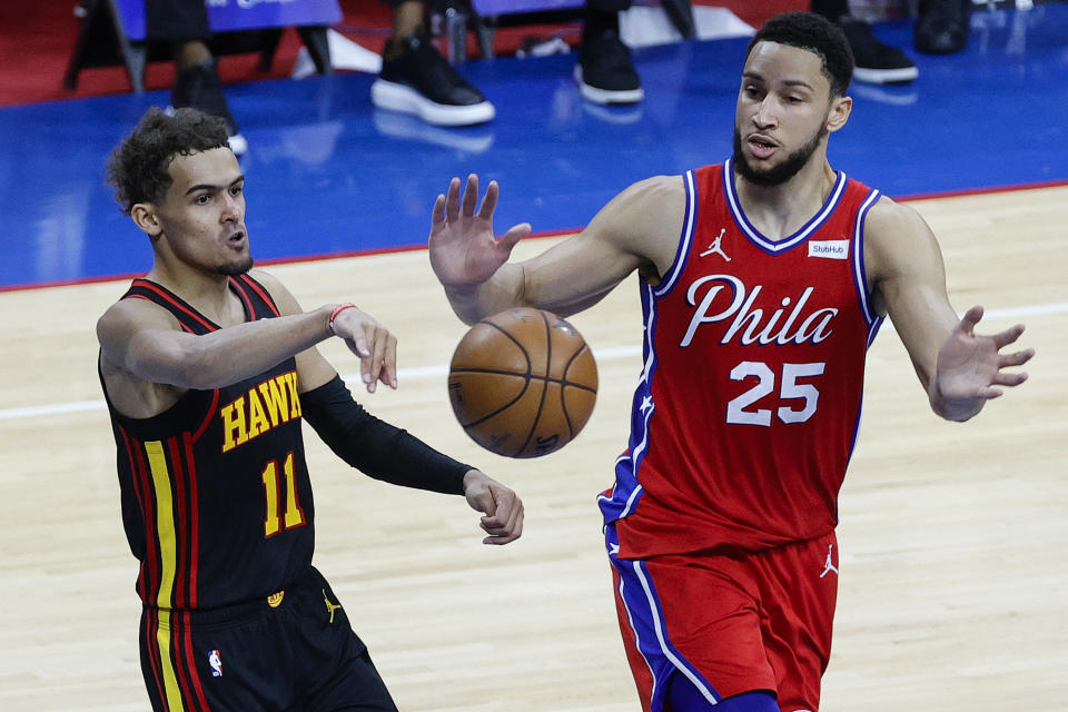 PHILADELPHIA, PENNSYLVANIA - JUNE 06: Trae Young #11 of the Atlanta Hawks passes past Ben Simmons #25 of the Philadelphia 76ers during the fourth quarter during Game One of the Eastern Conference second round series at Wells Fargo Center on June 06, 2021 in Philadelphia, Pennsylvania. NOTE TO USER: User expressly acknowledges and agrees that, by downloading and or using this photograph, User is consenting to the terms and conditions of the Getty Images License Agreement. (Photo by Tim Nwachukwu/Getty Images)