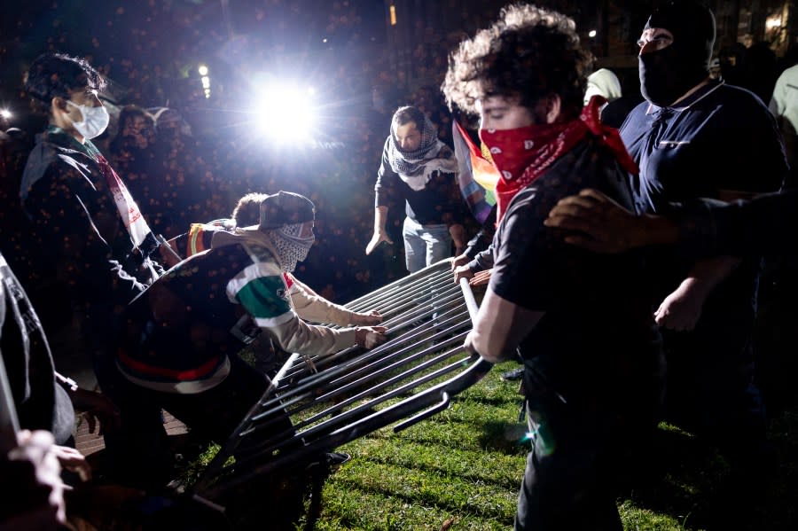 Counter protesters attack a pro-Palestinian encampment set up on the campus of the University of California Los Angeles (UCLA) as clashes erupt, in Los Angeles on May 1, 2024. Clashes broke out on May 1, 2024 around pro-Palestinian demonstrations at the University of California, Los Angeles, as universities around the United States struggle to contain similar protests on dozens of campuses. (Photo by ETIENNE LAURENT / AFP) (Photo by ETIENNE LAURENT/AFP via Getty Images)