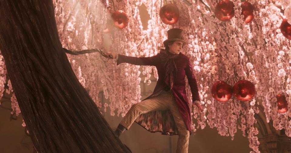 Willy Wonka (Timothée Chalamet) dances in his fantastical chocolate shop in a scene from "Wonka."