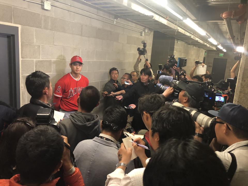 Shohei Ohtani talks to reporters after his third spring training game. (Yahoo Sports)