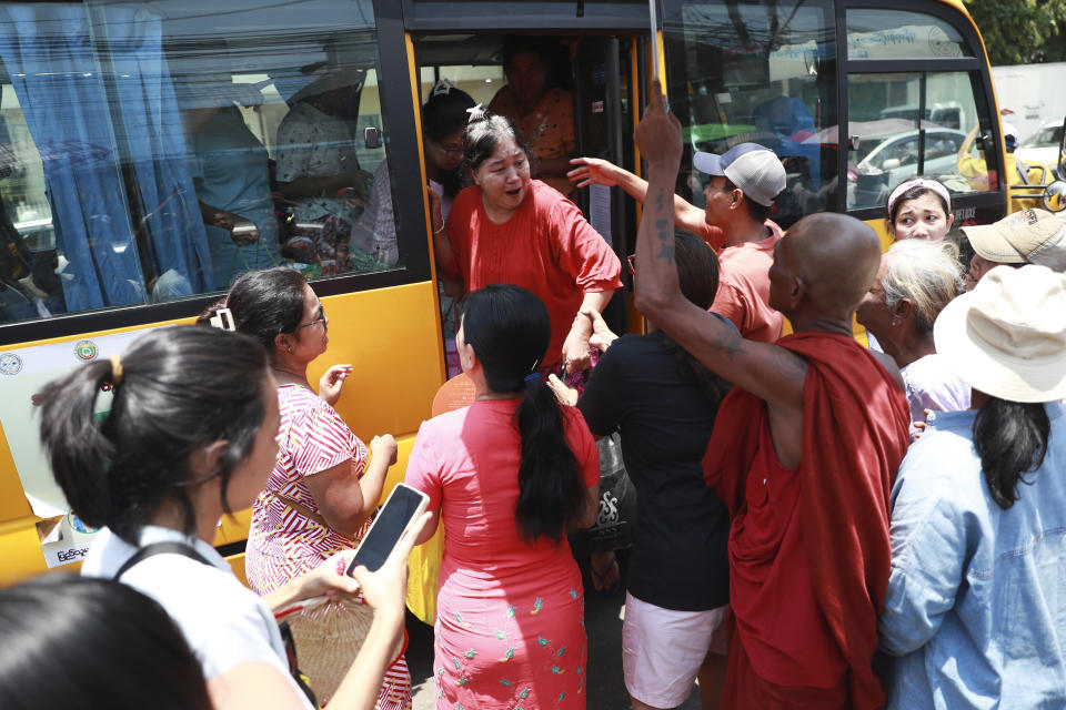 Released prisoners are welcomed by family members and colleagues after they were released from Insein Prison Wednesday, April 17, 2024, in Yangon, Myanmar. On Wednesday Myanmar's military government granted amnesty for over 3,000 prisoners to mark this week’s traditional New Year holiday. (AP Photo/Thein Zaw)