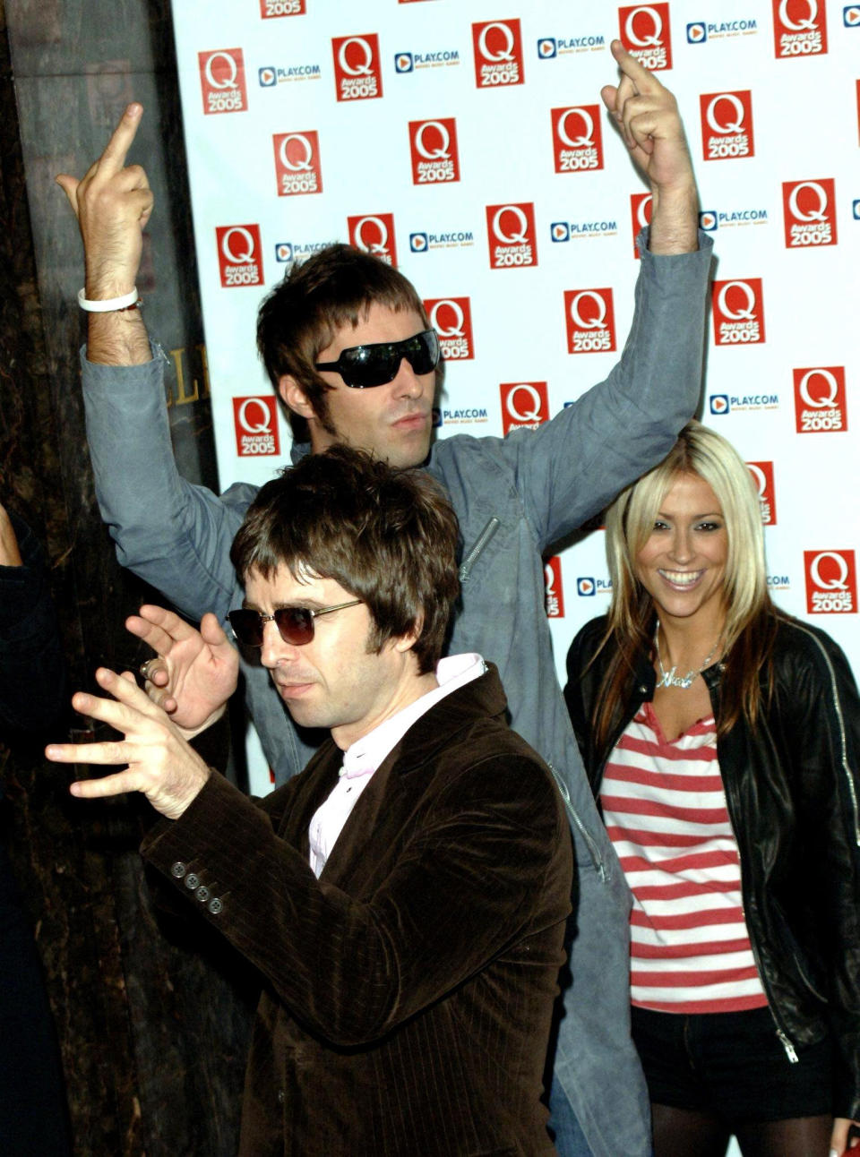 Noel (L) and Liam Gallagher arrive with Liam's partner Nicole Appleton for the annual Q Awards 2005, the music magazine's annual awards ceremony, at the Grosvenor House Hotel, central London.