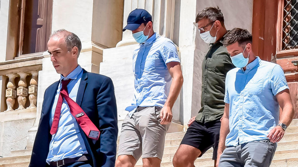 Manchester United captain Harry Maguire (centre) is seen here leaving a Greek court.