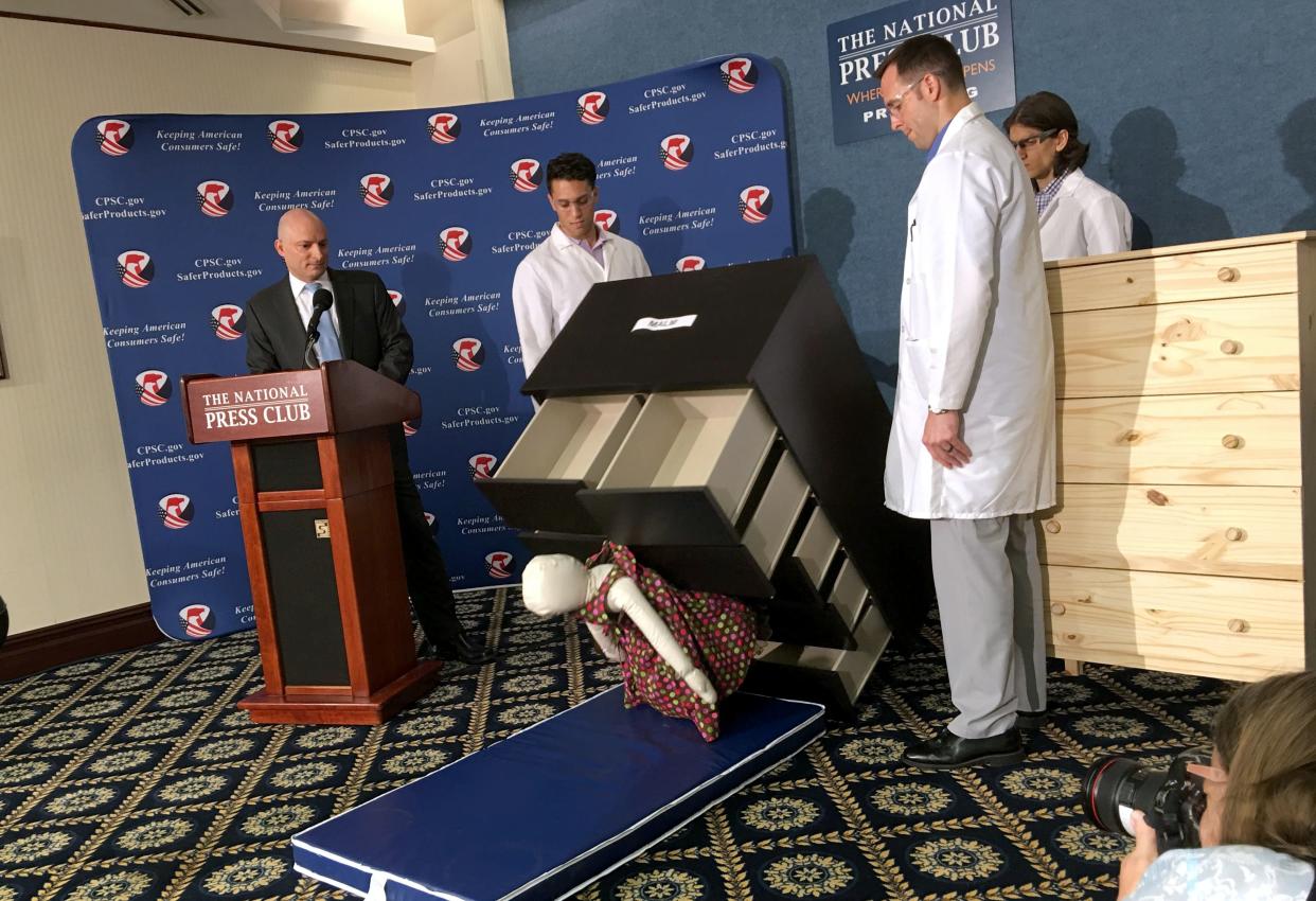Elliot Kaye (left), then chair of the U.S. Consumer Product Safety Commission, and colleagues watch as a 28-pound dummy falls under Ikea's Malm model dresser in June 2016. (Photo: CARLOS HAMANN via Getty Images)