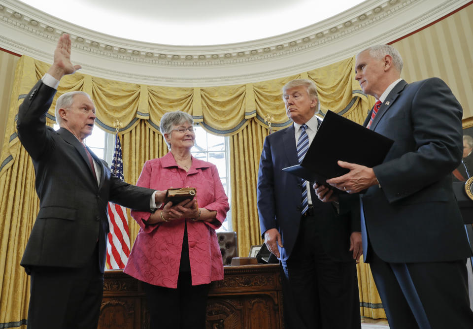 Vice President Mike Pence swears in Jeff Sessions as U.S. attorney general on Feb. 9, 2017, with President Trump and Sessions’s wife, Mary, watching. (Photo: Pablo Martinez Monsivais/AP)