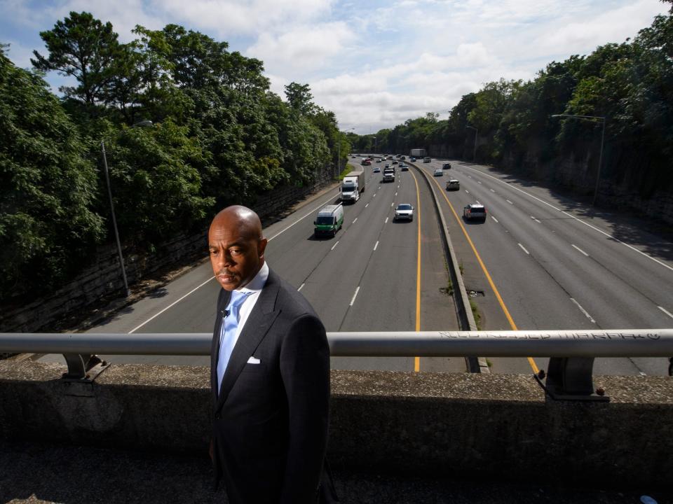 Tennessee State Rep. Harold Love, Jr. stands on an overpass over I-40