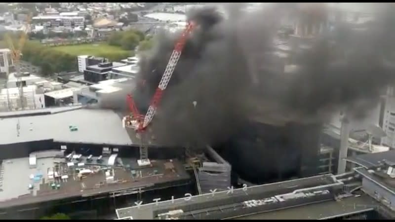 Smoke rises as a fire blazes at Sky City Convention Centre, which is under construction in Auckland