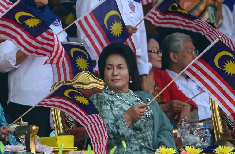 Rosmah Mansor, wife of Malaysia's Prime Minister Najib Razak, waves a national flag during National Day celebrations, at Independence Square in Kuala Lumpur, on August 31, 2015