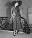 <p>Likewise, Christian Dior employed a fuller skirt silhouette in his fall 1951 collection. The early '50s often saw a fall ensemble completed with a coordinated hat or headpiece. <br></p>