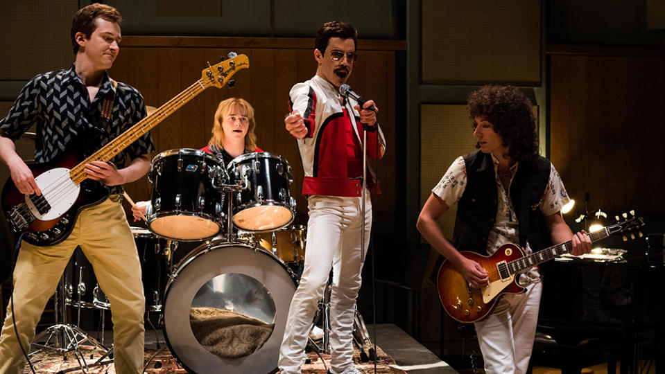 Joe Mazzello (John Deacon), Ben Hardy (Roger Taylor), Rami Malek (Freddie Mercury), and Gwilym Lee (Brian May) in Bohemian Rhapsody (Credit: Fox)