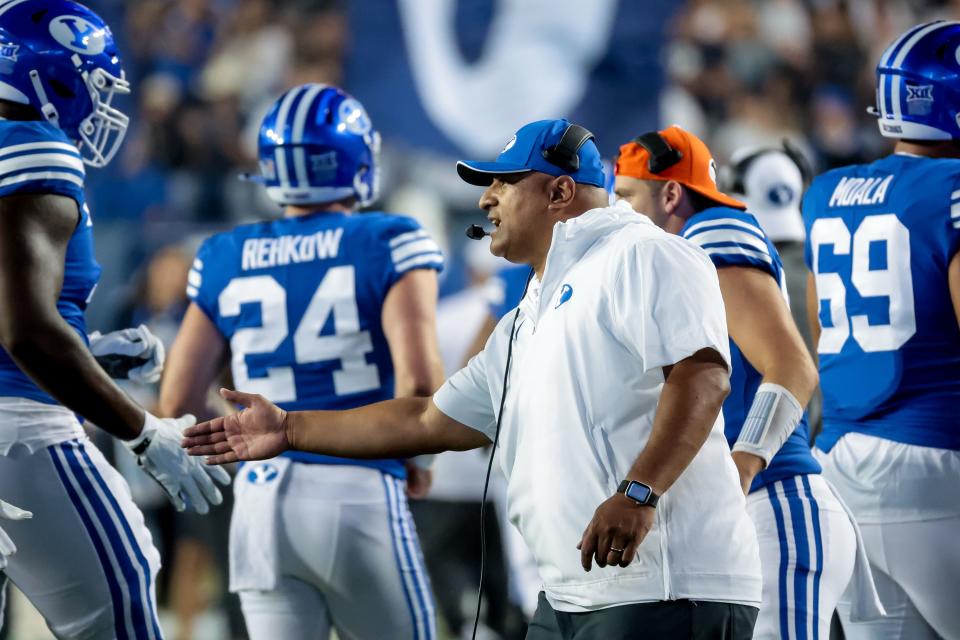 BYU Cougars head coach Kalani Sitake celebrates with players after a touchdown during the game against the Sam Houston Bearkats at LaVell Edwards Stadium in Provo on Saturday, Sept. 2, 2023. | Spenser Heaps, Deseret News