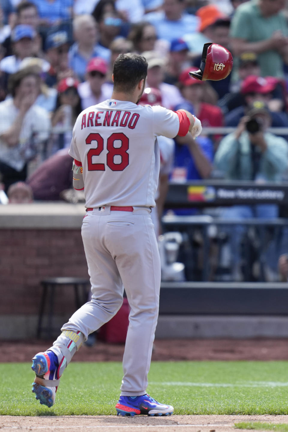St. Louis Cardinals' Nolan Arenado throws his helmet after striking out during the sixth inning of a baseball game against the New York Mets at Citi Field, Sunday, June 18, 2023, in New York. (AP Photo/Seth Wenig)